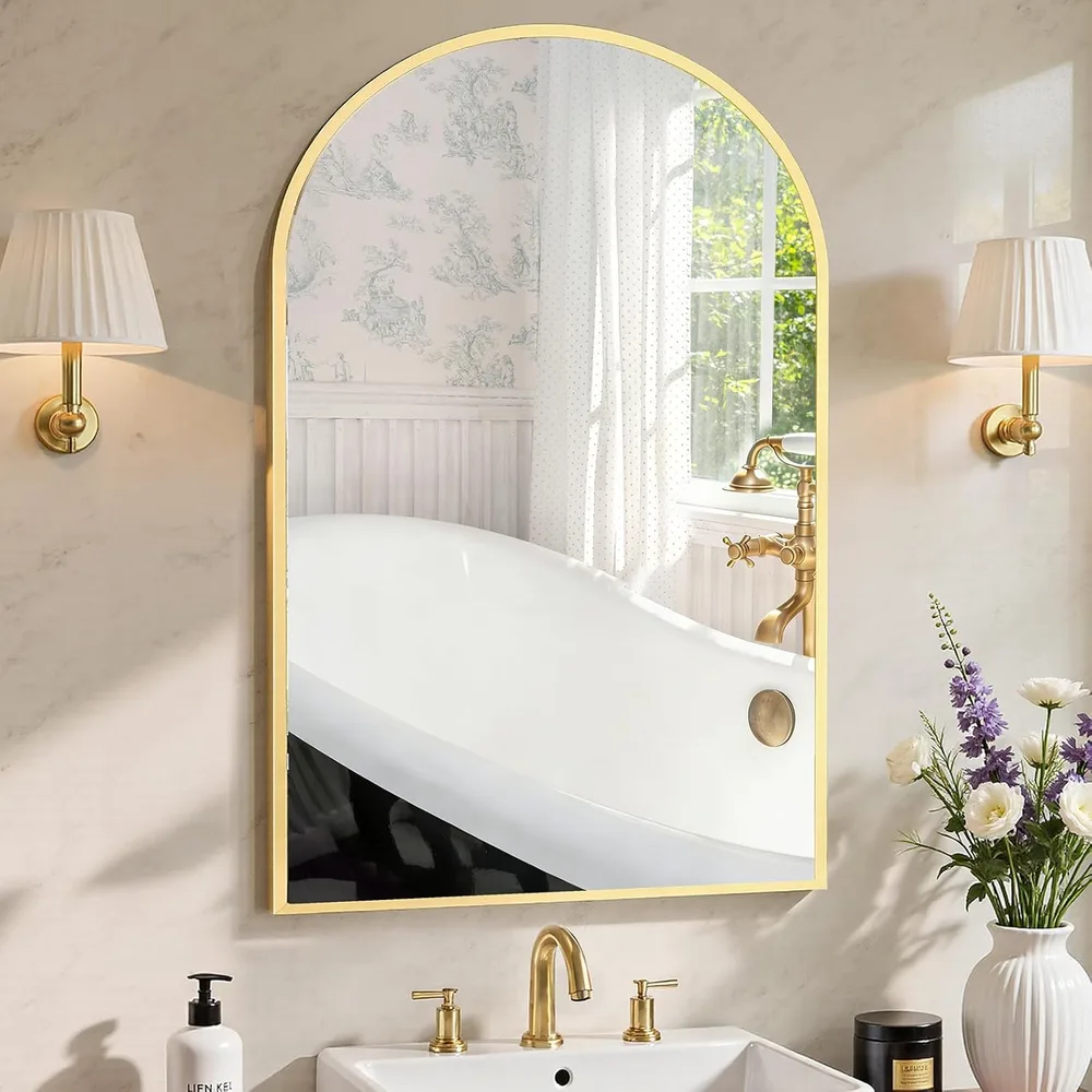 Sweetcrispy arched gold-framed mirror mounted above a bathroom vanity